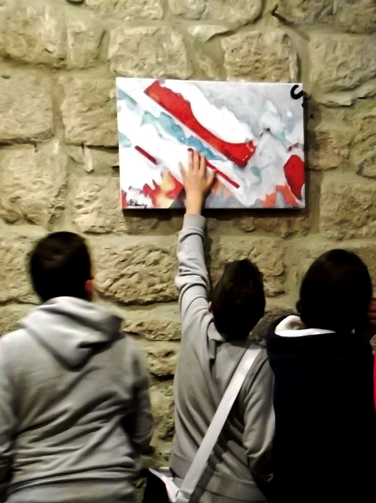 VOTE IT FOR "PHOTO-ACTIONS". Students visiting Roberto Alborghetti's "Colors of an Apocalypse" exhibition at Aldobrandesca Fortress (XIII Century) in Tuscany (Piancastagnaio, Siena)  Italy